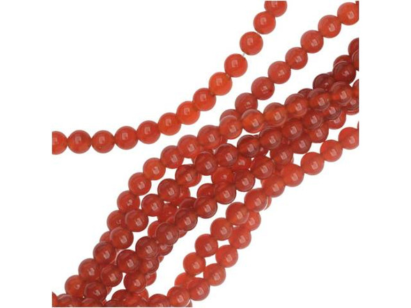 Rich style fills the Dakota Stones 4mm carnelian round beads. Available by the strand, these beads feature a perfectly round shape. They are small in size, so you can use them as spacers or as accents of color in earrings. Each bead displays a rich reddish-orange color. Carnelian is a translucent chalcedony or an A-grade agate that receives its beautiful red tints from iron oxides. Most deep red carnelian is heat treated to darken the material evenly. Carnelian is also known as the Mecca stone and natural agate. It has a Mohs hardness of 6.5. Metaphysical Properties: Often known as a motivation stone, carnelian is used for physical training and balancing body energy levels.Because gemstones are natural materials, appearances may vary from piece to piece. Carnelian is heat-treated to have a consistent color across the bead and strand. The color is very consistent. Each strand includes approximately 52 beads.