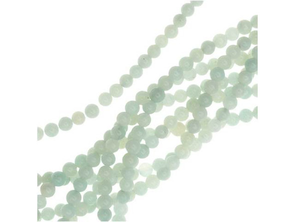 You'll love the beachy style of these Dakota Stones Amazonite 4mm round beads. These beads are round in shape for a classic look you can add to any design. They are small in size, so use them as spacers or as pops of color in earrings. Each bead features opaque ocean colors that range from blue-green to green. Amazonite is also known as Amazon stone. Metaphysical Properties: Amazonite is said to balance energy, while promoting harmony and universal love. It is often called the stone of courage and the stone of truth, as it provides the ability to discover truths and integrity.Because gemstones are natural materials, appearances may vary from piece to piece. Each strand includes approximately 52 beads.