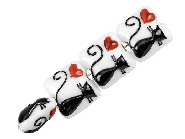 Feline fashion starts with these Grace Lampwork beads. These beads feature a square pillow shape with a puffed dimension, so they will stand out in your jewelry designs. Both sides of each bead are decorated with a black cat silhouette with a red heart on a creamy white background. You can showcase these beads in necklaces, bracelets, or even earrings. They are perfect for any cat lover. This item is handmade, so appearances may vary.