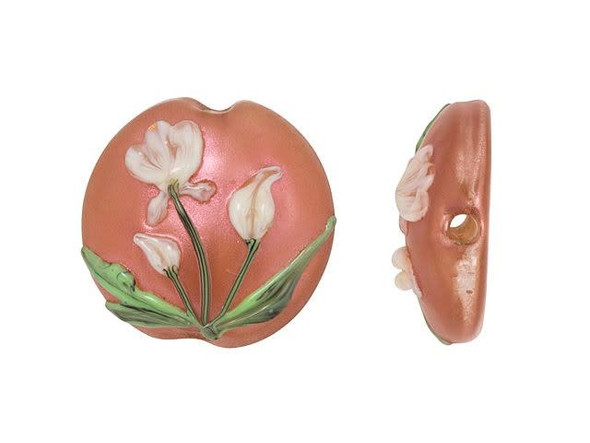 Spring elegance fills this Grace Lampwork bead. This bead features a coin or lentil shape. The front is decorated with a raised design of creamy white flowers with green stem and leaves on a shimmering sunset coral pink background. This is a beautiful design that will put you in mind of pleasant spring evenings. The front is slightly domed, so it will stand out in designs. The back of the bead is flat and plain. String this bead onto a head pin for a quick pendant or try it at the center of bead embroidery. This item is handmade, so appearances may vary.
