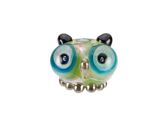 Make sure your designs are as cute as can be with this adorable owl bead. This rounded glass bead from Grace Lampwork takes on the shape of a tiny owl, complete with wide eyes, tufted ears, and little feet. You'll immediately fall in love with this little guy. String it onto a head pin for an instant pendant. The green body and blue eyes will work well with ocean colors.This item is handmade, so appearances may vary. Length 9-9.5mm, Width 15mm