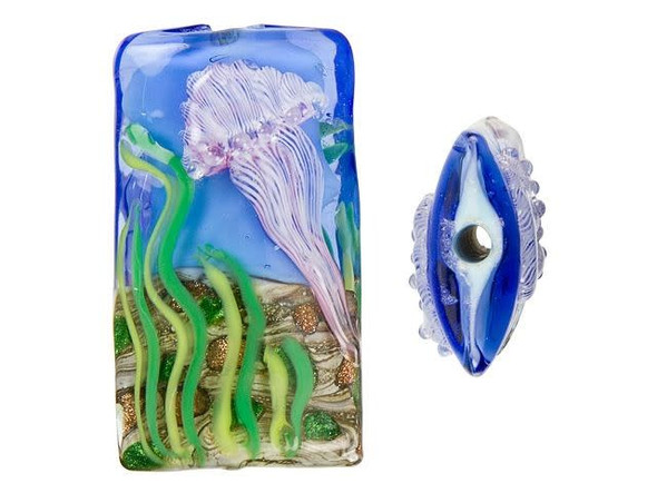 Looking for a unique bead to add to your handmade jewelry collection? Look no further than the Grace Lampwork Sea Jellies Kalera Focal Bead. With its bold rectangular shape and raised design of a striped pale purple jellyfish floating in front of green seaweed on the ocean floor, this bead will transport you under the sea. The design is displayed on both sides of the bead, so it will always look great from any angle. This handmade glass bead is truly one-of-a-kind, making it the perfect addition to your next DIY project. Let this bead be the centerpiece of your bracelet or slide it onto a head pin for an instant pendant that's sure to turn heads. Shop now and bring a touch of nature to your handmade creations!