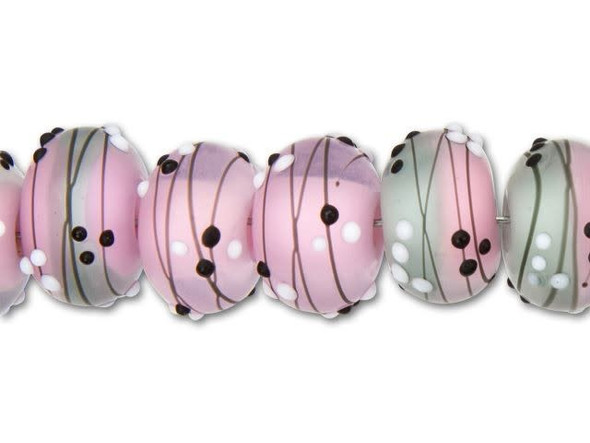 For a sweet look, try the Grace Lampwork Princess Party roundel beads in your designs. These rounded beads feature pink and gray frosted glass decorated with black lines and black white dots. The pink color and elegant style adds the perfect princess style. Use them in feminine looks. These beads feature a versatile size that will work well in necklaces and bracelets.This item is handmade, so appearances may vary. Diameter 12.5mm, Hole Size 2.6mm/10 gauge, Length 8-8.5mm