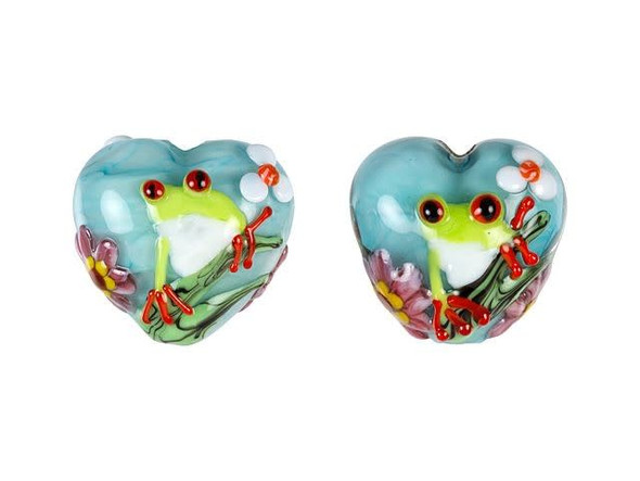 Liven up your style with this Grace Lampwork bead. This bead features a subtle heart shape and a puffed dimension that will stand out in your jewelry designs. Both sides are decorated with a bright green tree frog staring with red eyes. The frog is surrounded by sweet pink and white flowers on a soft blue background. You can add this bead to a head pin for a quick pendant or try it at the center of a bracelet design. It will add cheerful beauty anywhere.This item is handmade, so appearances may vary.19.4 x 18.4mm