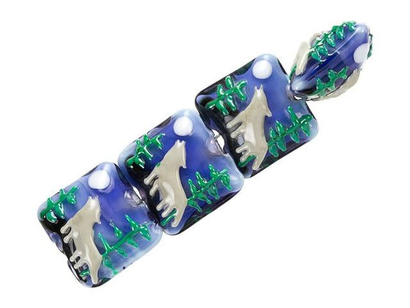 Unleash your wild side with the Grace Lampwork Wolf Howling at the Moon Pillow Bead Strand. Crafted from high-quality glass, these beads measure about 15 x 15mm and boast a unique square and cube shape that's sure to catch the eye. Featuring a Gray wolf howling at the moon, green pine trees, and a midnight blue sky, these beads are perfect for nature-inspired jewelry pieces. Use them to create stunning and unique necklaces, bracelets, or earrings that are guaranteed to turn heads. Please note that as they are handmade, appearances may vary, adding to the charm of these exquisite beads.