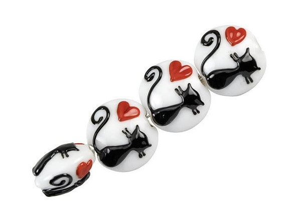 Show off your love of cats with these Grace Lampwork beads. These beads are round in shape and features a slightly puffed dimension. Each bead features a raised design of a black cat silhouette with a red heart on a creamy white background. This design is featured on both sides of each bead, so it will look great from any angle. Use these beads in necklaces, bracelets, or earrings for feline perfectionThis item is handmade, so appearances may vary.