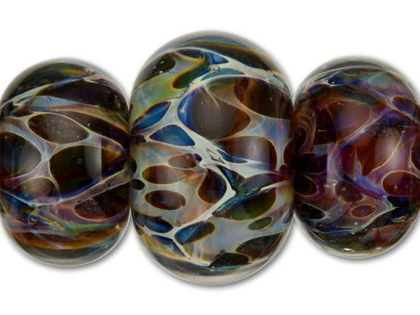 Give earth tone designs a touch of otherworldly color with these Grace Lampwork roundel beads. Each handmade glass bead features its own unique display of rainbow tones with spotted details, all captured inside a clear roundel shape. With varying sizes of beads, including two small beads, two medium and one large, this strand is ideal for using in elaborate jewelry designs. Match the wild coloring in a necklace or bracelet design with other vibrant tones or with tropical palettes.This item is handmade, so appearances may vary. Diameter 13-18mm, Length 8-11.5mm
