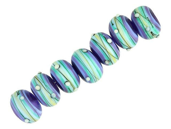Put a touch of whimsical style into your projects with the Grace Lampwork Swirl Party rondelle beads. These rounded beads feature frosted light purple, teal, and aqua stripes decorated with black lines and white dots. These elegant and sophisticated beads have the perfect amount of fun style to spice up your designs. You'll love adding these beads to your necklace and bracelet designs. This item is handmade, so appearances may vary.