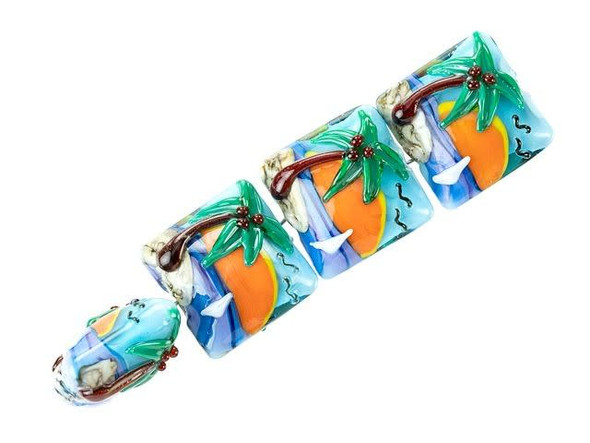 Commemorate a special vacation or start dreaming of the next one with these Grace Lampwork beads. These beads feature a square shape with a puffed dimension, so they will stand out in designs. Each bead features a raised design of a tropical island scene, complete with a palm tree, ocean waves, and a large setting sun. This design is featured on the front and back of each bead, so they will look great from any angle. Use them in necklaces, bracelets, and earrings. This item is handmade, so appearances may vary.