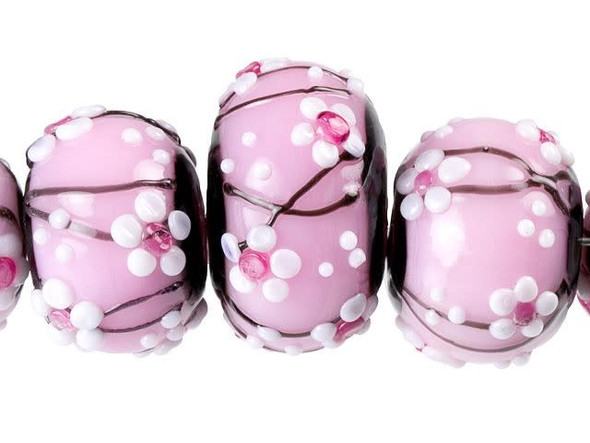 An elegant display can be yours with these Grace Lampwork beads. These five glass beads are graduated in size and feature raised cherry blossom designs on a pale pink background. Cherry blossoms are exquisite flowers that you'll want to showcase in your jewelry designs. Use these beads together in a necklace or bracelet. They would look wonderful with spring green or sky blue colors.This item is handmade, so appearances may vary. Diameter 9-12mm, Length 9-12mm