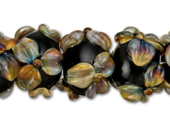 For a regal feel in your fashion, get these Grace Lampwork roundel beads. Each lovely handmade glass bead displays a solid black surface that is decorated with detailed flowers for extra texture. Each raised flower features a tie-dye effect of rainbow coloring that looks great when paired with other solid colors. Use these beads in a necklace or bracelet design as focals for an eye-catching statement.This item is handmade, so appearances may vary. Diameter 13-14mm, Length 9-10mm