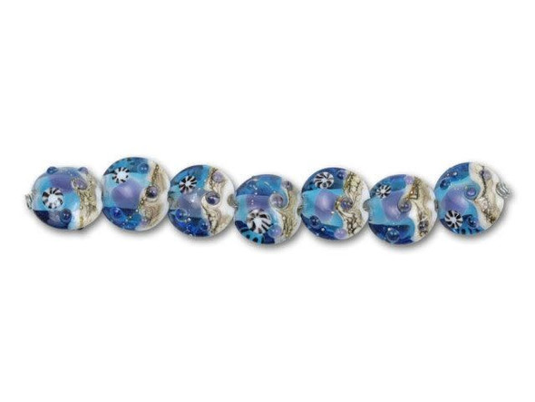 Clear aqua glass rests just above textured beige in these detailed beads, creating the impression of a bright day on the ocean floor. Playful dots and striped circles scattered inside the blue hint at ocean critters. Each bead in this seven-piece set was hand-designed by a glass artisan and will vary slightly in appearance.This item is handmade, so appearances may vary. Length 14-15mm, Width 15-16mm