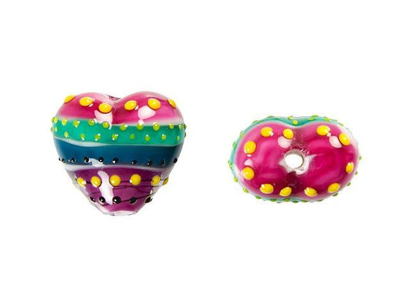 Give your designs a colorful focal with this Grace Lampwork bead. This bead features a subtle heart shape with a puffed dimension. It features a fun pattern full of stripes, lines, and dots. The stripes are purple, teal, and white, while the dots are yellow and black. The stringing hole runs vertically through the heart, so you can turn it into a pendant with a head pin or simply string it into designs. Pair it with other colorful beads for a playful look. This item is handmade, so appearances may vary.