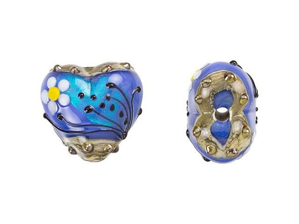 Add a lovely artistic touch to designs with this Grace Lampwork bead. This bead features a sweet heart shape with a puffed dimension. Both sides of the bead are decorated with a white and yellow daisy and black swirls and dots. The inside of the glass shimmers with an elegant powder blue color that lights up with aqua glitter. You can string this bead onto a head pin to turn it into a pendant or try it on a beaded strand. This item is handmade, so appearances may vary.