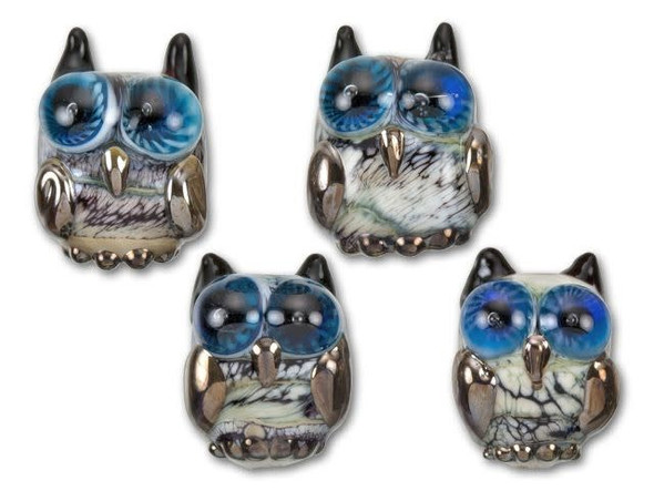 You'll have a hoot using this owl bead in your next design. This small bead from Grace Lampwork displays a detailed black and white owl, complete with big blue gazing eyes. Every bit of this bead is lined in detail from the horned ears to the textured bumpy feet. Use this bead in nature-inspired jewelry or string it alone on a dark silk ribbon for a fun necklace.This item is handmade, so appearances may vary. Depth 15-17mm, Length 20.5-22.5mm, Width 16-18mm