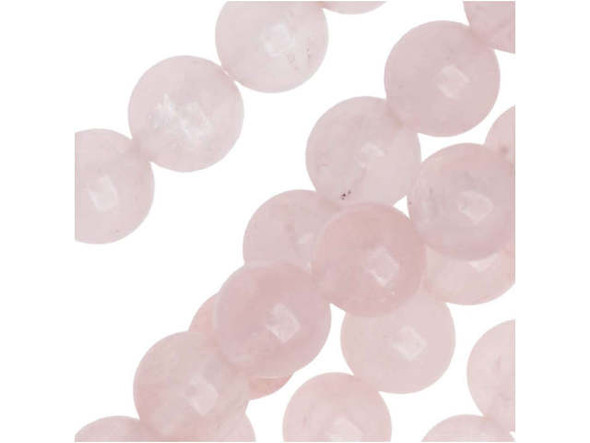 Let graceful color accent your designs with the Dakota Stones rose quartz 6mm round beads. Available by the strand, these beads are perfectly round in shape and display a soft, pale pink shade full of hazy beauty. It has a hazy to translucent look due to microscopic fibrous inclusions of pink borosilicate mineral related to Dumortierite. Rose quartz is the stone of gentle love. Mined in North America, South America, Europe and Africa, it is said to lower stress, as well as bring brightness, compassion, kindness, tolerance and gentleness. These beads feature a versatile size that will work anywhere.Because gemstones are natural materials, appearances may vary from bead to bead. Each strand includes approximately 34 beads.