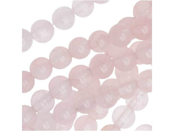 Bring delicate color to your designs with the Dakota Stones rose quartz 4mm round beads. Available by the strand, these beads are perfectly round in shape and display a soft, pale pink shade full of hazy beauty. It has a hazy to translucent look due to microscopic fibrous inclusions of pink borosilicate mineral related to Dumortierite. Rose quartz is the stone of gentle love. Mined in North America, South America, Europe and Africa, it is said to lower stress, as well as bring brightness, compassion, kindness, tolerance and gentleness. These small beads would make excellent spacers.Because gemstones are natural materials, appearances may vary from bead to bead. Each strand includes approximately 52 beads.