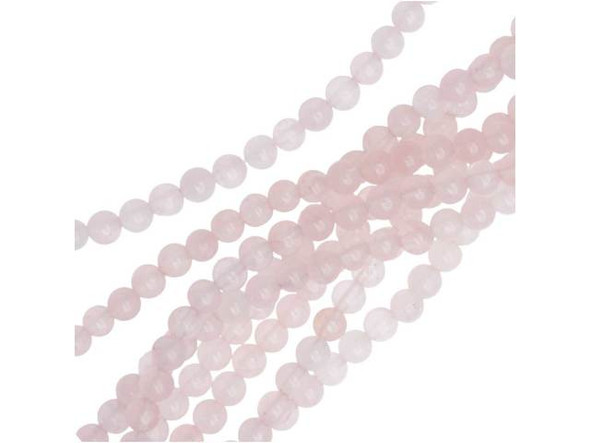 Bring delicate color to your designs with the Dakota Stones rose quartz 4mm round beads. Available by the strand, these beads are perfectly round in shape and display a soft, pale pink shade full of hazy beauty. It has a hazy to translucent look due to microscopic fibrous inclusions of pink borosilicate mineral related to Dumortierite. Rose quartz is the stone of gentle love. Mined in North America, South America, Europe and Africa, it is said to lower stress, as well as bring brightness, compassion, kindness, tolerance and gentleness. These small beads would make excellent spacers.Because gemstones are natural materials, appearances may vary from bead to bead. Each strand includes approximately 52 beads.