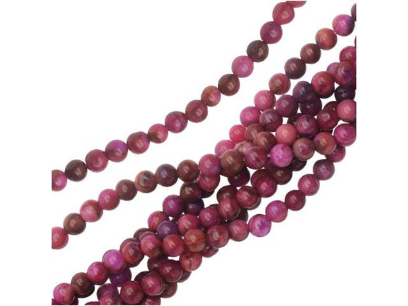 For a touch of fun color in your projects, try these Dakota Stones beads. They feature deep pink color with swirling patterns. They are small in size, so they will bring fun pops of color to necklaces, bracelets, and earrings. Mexican crazy lace agate is normally an opaque white gemstone with swirling patterns, but these beads are color enhanced with pink coloring to emphasize these beautiful patterns. Color enhancing is common amongst agates to make them fashionably relevant. They have a Mohs hardness of 6.5-7. Metaphysical Properties: Often called the happy stone, crazy lace agate promotes laughter and optimism. Because gemstones are natural materials, appearances may vary from bead to bead. Each strand includes approximately 52 beads.