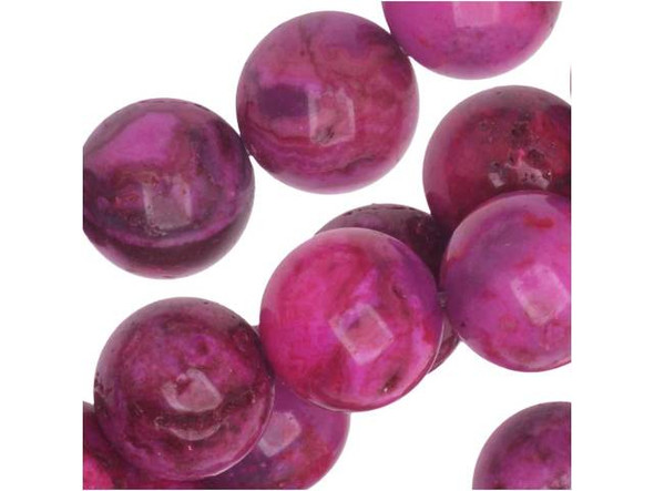 Dress up your style with some sweet color. These Dakota Stones beads feature deep pink color full of swirling style. They would surely stand out in necklaces and bracelets. Mexican crazy lace agate is normally an opaque white gemstone with swirling patterns, but these beads are color enhanced with pink coloring to emphasize these beautiful patterns. Color enhancing is common amongst agates to make them fashionably relevant. They have a Mohs hardness of 6.5-7. Metaphysical Properties: Often called the happy stone, crazy lace agate promotes laughter and optimism. Because gemstones are natural materials, appearances may vary from bead to bead. Each strand includes approximately 20 beads.