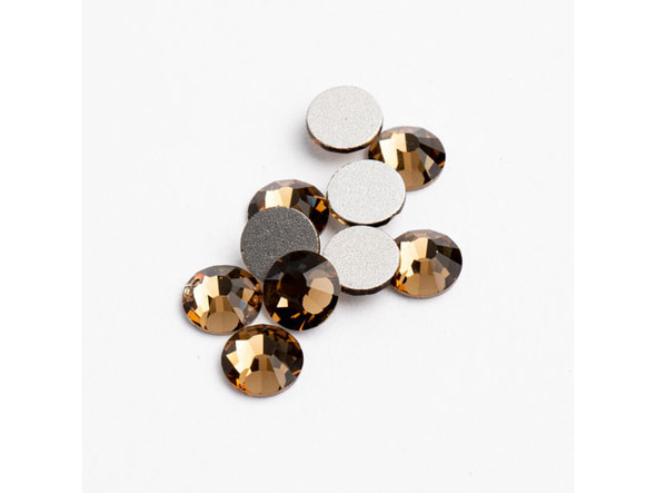 Looking for a way to add some serious sparkle to your DIY crafts? Look no further than Crystal Lane Flat Back Rhinestones SS30 in Smoked Topaz! These stunning crystals are perfect for adding an elegant touch to your handmade jewelry, home decor, costumes, and apparel. The magnificent Smoked Topaz color will dazzle and shine, ensuring that your work of art stands out from the rest. With 72 pieces included in each pack, these foil-backed crystals are an affordable and high-quality choice that will elevate any project to new heights. Give your creations the shine they deserve - choose Crystal Lane Rhinestones today!
