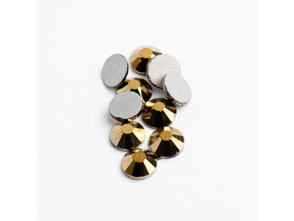 Looking to add a touch of glamour and elegance to your handmade DIY jewelry, costumes, or decor? Look no further than Crystal Lane Flat Back Rhinestones SS20 (4.7mm) in Metallic Gold! These high-quality, foil-backed rhinestones are made from dazzling crystal and will add an exceptional shine to any project you create. With 144 pieces per pack, you'll have the freedom to create bold designs that will take everyone's breath away. Bring out your inner artist and make a statement with Crystal Lane's Metallic Gold flat back rhinestones - your one-stop shop for all things bling and sparkle!