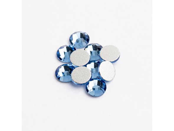 Elevate your handmade jewelry designs and craft projects with Crystal Lane's Flat Back Rhinestones in Light Sapphire. These dazzling SS20 crystals shimmer and shine with a vibrant blue hue that's sure to capture attention and admiration. The foil-backed design amplifies the sparkle factor, giving your creations an instant boost of elegance and glamour. This pack of 144 pieces provides ample rhinestones for multiple projects, so let your creativity run wild! Add a touch of radiance with Crystal Lane's Flat Back Rhinestones in Light Sapphire and enjoy crafting the most stunning accessories and decor.