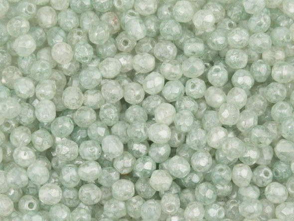 Add a touch of color to your handmade jewelry with these enchanting Czech Fire-Polish Beads. In a delightful 3mm size, these beads boast a mesmerizing stone green shade, elegantly accented by a textured white coating. The luster finish adds a soft sheen, making each facet shine with captivating brilliance. Crafted from high-quality Czech glass by the esteemed brand Starman, these beads guarantee both durability and beauty for your DIY projects. Elevate your creations and infuse them with a touch of nature's splendor with these stunning Czech Fire-Polish Beads.