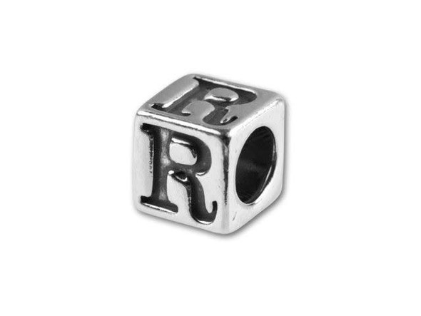 This quality sterling silver alphabet bead features the letter R engraved into four sides. Made in the USA, this 4.5mm alphabet bead features a wonderful cube shape that will stand out in your designs. You can use the wide stringing hole with thicker stringing materials, too. 