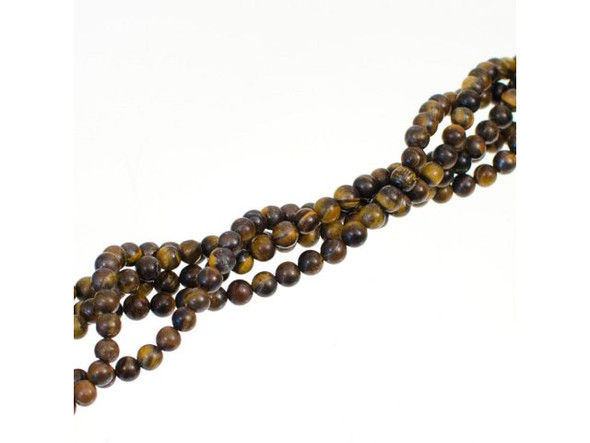 Tigereye Beads come in richly chatoyant browns and yellows with a golden luster. While legends exist of Roman soldiers wearing this "all seeing" stone for protection in battle, tigereye was not considered a semiprecious gemstone until the late 19th century. Today, tigereye beads are some of our gemstone best sellers!The stone is also known as African cat's eye, crocidolite, and tiger's eye, and was once even called griqualandite, named after Griqualand West in Africa, where the finest examples of the stone were mined.Protect tigereye jewelry components from scratches, sharp blows, and large temperature changes. Because of their chatoyance, tigereye beads and pendants should not be cleaned with alcohol or abrasives. It can be helpful to treat the stone with oils like Goo Gone.  Please see the Related Products links below for similar items, and more information about this stone.