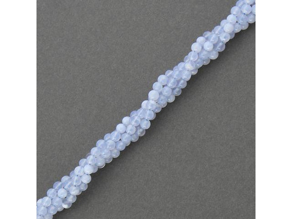 Chalcedony beads are a semitransparent or translucent (commonly pale bluish-gray) form of quartz, with a waxlike luster. Chalcedony forms in rounded crusts, rinds or stalactites in volcanic and sedimentary rocks. The stone is porous, so it takes dye easily and is frequently enhanced. Chalcedony has a slightly lower density and hardness than other quartz. Protect it from scratches, sharp blows, harsh chemicals and extreme temperatures.  Because of its abundance, durability and beauty, chalcedony was one of the first raw materials used by humankind. Seals were made from chalcedony in Mesopotamia as early as the 7th century B.C., and the Romans also adopted the practice. The stone was used in Renaissance magic for health and safety, and has been worn as carved cameos and gems for many centuries, especially popular in the Victorian era. In ancient times, it was used as a talisman against idiocy and depression. Today it is still believed to banish depression and mental illness, as well as fear, hysteria and touchiness. Chalcedony is also thought to reduce fever, aid eyesight, stimulate creativity and stimulate calm and peace.   Please see the Related Products links below for similar items, and more information about this stone.