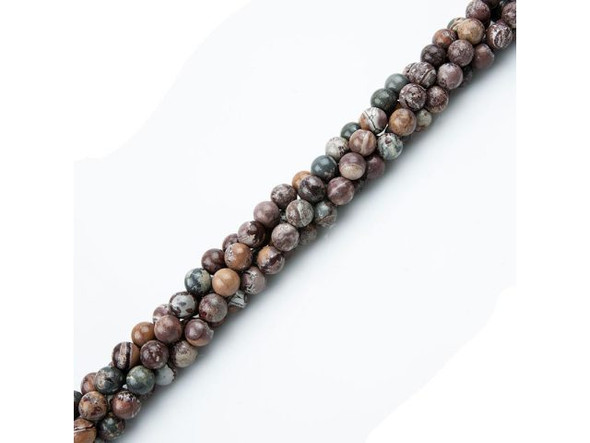 Our Sonora Jasper beads have striking desert-landscape patterns in subtle desert colors of red, brown, tan, cream and gray-blue. The tracks and circles on these beads are reminiscent of the famed "canals" on Mars, as well as dentritic sun-dried waterways on Earth. Our beads are not as vivid in hue as classic Sonora Sunrise or Sonora Sunset, but what they lack in hue, they make up for in dramatic patterns. Jaspers stones are believed to carry a strong connection to the Earth's energy, making jasper a helpful stone for grounding, stability and strength.Find related items below, and find out more about jasper in our Gemstone Index.