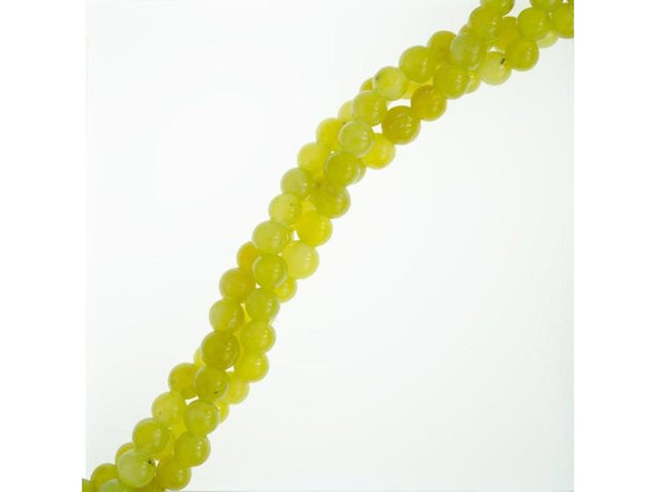 Olive Jade: Yellowish-green olive jade beads are occasionally called peridot stone due to their color (not because of any relationship to that gemstone). Olive jade is actually a form of serpentine, and is not a "true" jade. These semiprecious beads are softer and less dense than most real jade.Historically, serpentine was thought to protect the wearer from snake bites. Modern mystics say it has the power to restore self-confidence, dispel fear, enhance meditation, and balance female hormones.  Please see the Related Products links below for similar items, and more information about this stone.
