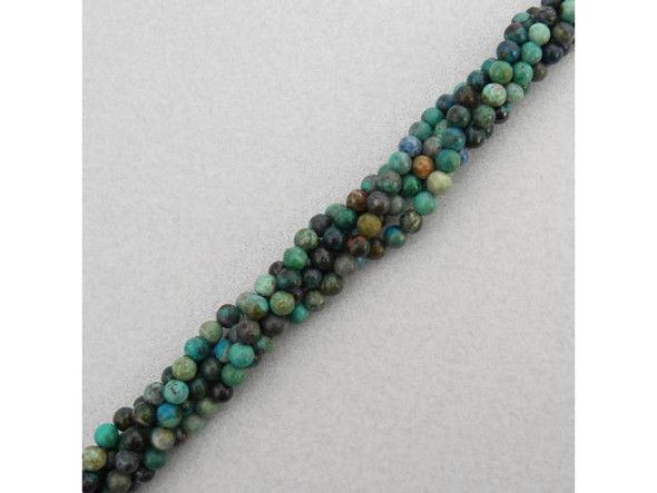 Chrysocolla is a hydrated copper phyllosilicate mineral, in shades of green, blue, blue-green, black and brown. It is commonly found in copper mines. Pure chrysocolla is soft and fragile. However, most chrysocolla beads are in a matrix of rock crystal (clear quartz) or silica, and has physical properties closer to that of quartz. When found in a brilliant blue state it can be mistaken for turquoise; typically, the brighter the blue or green color, the higher the price.Chrysocolla is also known as bisbeeite, chrysocole, crysocolla, chrysocolle, chrysocollite, chrysokolla, crisocola, crisocolla and gem silica.The name comes from the Greek chrysos, meaning "gold," and kolla, meaning "glue," due to its use as a flux to solder gold around 300 BC. The bluer shades of Chrysocolla are popular for the throat chakra, and are believed to promote clear communication and provide the courage to express oneself. The greener shades of Chrysocolla are popular for opening the heart chakra. The blue-green combination is believed to empower one to communicate in a clear, loving way.