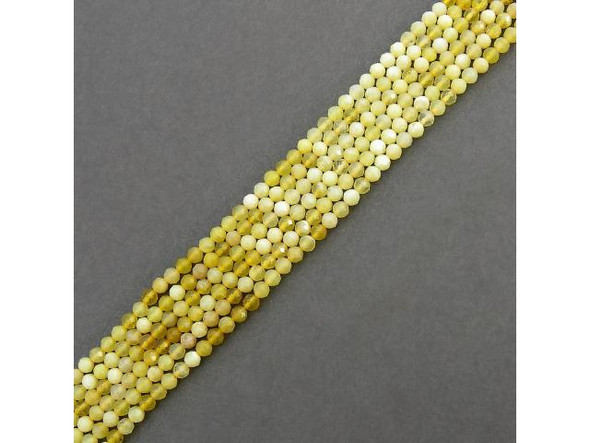 Yellow Opal gemstone beads have the same basic chemical composition as quartz, but usually contains 6 - 10% water. Common Opal (sometimes called opalite) does not have the flashes of light found in precious opal, but both common opal and precious opal are hydrated amorphous Silicon Dioxide. Our pretty Yellow Opal is somewhere in between: It is more translucent than most common opal, and has hints of opal fire (or maybe that's just flashes from the faceting)!  See Related Products links (below) for similar items and additional jewelry-making supplies that are often used with this item.