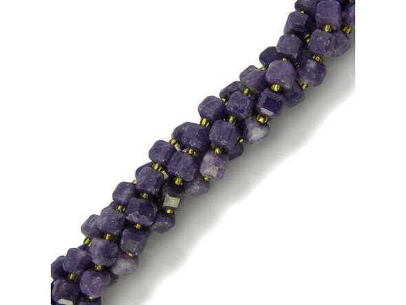 Lepidolite beads are cut from an uncommon mica that has been inconsistently available in the mineral market. Also known as gem lepidolite, lavenderine, and lepidolite mica, this semiprecious gemstone is a by-product of mining lithium. Unpolished lepidolite appears scaly, and its name derives from the Greek word lepidos, which translates to "scale." The color in these semiprecious beads ranges from violet to pale pink or white (or, occasionally, gray or yellow). Lepidolite beads can contain black markings which further add to their visual appeal. This gemstone is purported to have a calming effect, relieve muscle pain, relax nerves, and connect the heart and crown to bring spiritual understanding of pain and suffering. Lepidolite is also said to help people meet the challenges of change in their lives! Lepidolite rough is found in Zimbabwe, Sweden, Argentina, Canada (Quebec), Madagasgar, Russia, and the U.S.A. (California and Maine).   See the Related Products links below for similar items, and more information about this stone.