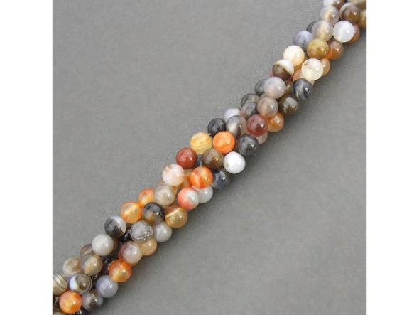 Persian Gulf Line Agate beads have all the favorite features of agate: Lovely layered stripes and swirls of mostly-translucent oranges, reds, browns, grays, peach, cream and white. These semiprecious banded agate beads are cut from a variety of chalcedony composed of quartz layers. In ancient times, agate was highly valued as a talisman or amulet. It was said to quench thirst and protect from fever. Persian magicians used agate to divert storms. Some believed that agate would render the wearer invisible, and due to its strength and durability, it is used for making ornaments or for astrological purposes. Agate is a cooling stone and is said to cure insomnia, protect against danger, promote strength and healing, and ensure a healthy life.  See the Related Products links below for similar items, and more information about this stone.