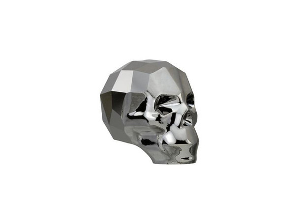 Dramatic style fills the PRESTIGE Crystal Components 5750 13mm skull bead in Crystal Silver Night 2X. Crystal gets an edgy and expressive spin in this unique skull bead. This darkly glamorous element is a masterpiece full of precision-cut facets. This statement piece will add rebellious energy to your designs and works well with spikes. This sparkling reminder to live life to the fullest is a powerful and intriguing bead that will mark you as a trend-setter. This bead features a dark charcoal color shot through with streaks of silvery sparkle.