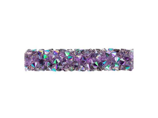 Whimsical sparkle fills this PRESTIGE Crystal Components bead. This Fine Rocks tube bead can be used easily on leather to create stunning jewelry or you can sew it into projects for beautiful textile applications. This bead allows you to bring a glittering pave look to designs. The surface is covered in double-pointed size PP14 chatons featuring glittering purple and teal tones. This long tube bead does not feature end caps, so you can layer several together, easily integrate it into unique color palettes, and more.