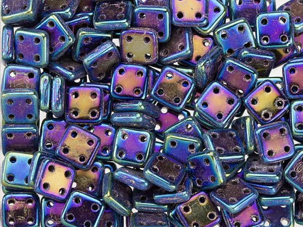 A majestic display fills the CzechMates glass 6mm four-hole blue Iris QuadraTile beads. These thin square-shaped beads feature rounded corners and a stringing hole in each of the four corners. You can add these beads to designs in unique ways. Stack and layer them, use them in multi-strand designs, add them to bead embroidery and more. There are so many possibilities with these little squares. They feature metallic purple and blue color with hints of green. 