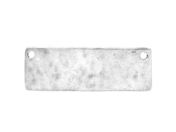 You can create outstanding jewelry with help from the Nunn Design antique silver-plated pewter grande hammered thin flat tag pendant. This flat pendant is rectangular in shape and features a versatile size. The stringing holes are located in the two top corners, so you can showcase this pendant in unique ways. Try it at the center of a chain necklace. The hammered texture adds an interesting look. Use metal stamps to create a personalized look. This pendant features a versatile silver shine that will work anywhere. Hole Size 1.6mm/14 gauge, Length 12.5mm, Width 37.5mm