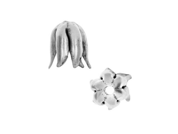 Start your designs with flowery beauty using this Nunn Design bead cap. This bead cap features a floral look with petals that curl slightly at the tips, creating a tulip style. The elongated shape of this bead cap is perfect for creating dangles, starting tassels, layering with other bead caps, and more. Try it with Czech glass beads for an organic style you'll love. This cap features a versatile silver color that will work anywhere. Fits Bead Size 8mm, Hole Size 1.63mm/14 gauge, Length 10.5mm, Width 9mm