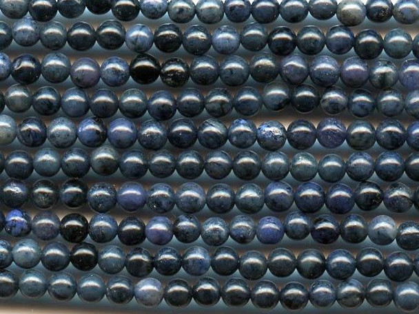 Give your designs a touch of regal color using the dumortierite 4mm round beads from Dakota Stones. These beads feature deep blue color that looks good with creamy neutrals and bold gold tones, too. Their tiny size makes them perfect for using as accents of color for all kinds of designs. Dumortierite is a fibrous variably colored aluminum boro-silicate mineral. They crystals are vitreous and vary in color. Metaphysical Properties: Known as the "Stone of Order," dumortierite is said to help boost intellectual perception and to help in becoming more organized.Because gemstones are natural materials, appearances may vary from piece to piece. Each strand includes approximately 52 beads.