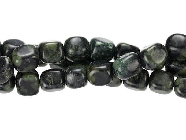 Unique green and black swirls fill these Dakota Stones gemstone beads. These beads feature a rectangular nugget shape sure to stand out in designs. Add them to long necklace strands, showcase them in bold earrings, and more. You'll love using them in your designs. Kambaba jasper is mined exclusively in Africa and is also known as crocodile jasper due to its combination of dusky green base color and deep brown and black tapered oval rings. The swirling green color is caused by ancient fossilized algae, one of the oldest known forms of life on earth. Metaphysical Properties: Like all jaspers, this stone is metaphysically tied to grounding and protection. It's also said to enhance endurance, patience, and insight. Because gemstones are natural materials, appearances may vary from piece to piece. Each strand includes approximately 14 beads.