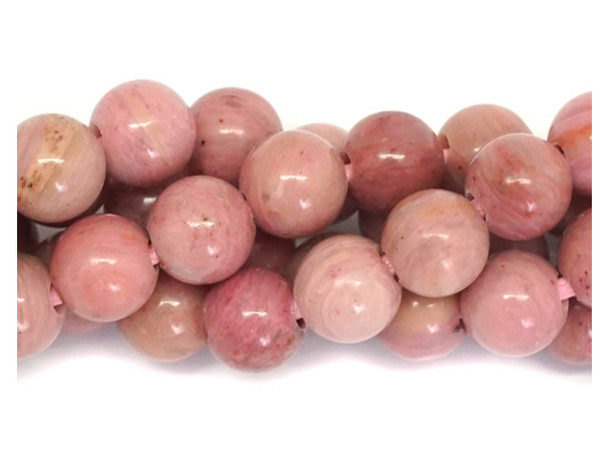 Add gemstone style to your next design with these beads from Dakota stones. These beads are perfectly round in shape and feature a versatile size that you can use in all kinds of designs. These beads would look wonderful in matching necklace and bracelet sets. Their large stringing hole makes these beads great for use with thicker stringing materials. Rhodonite, whose name is derived from the Greek word for Rose, &ldquo;rhodon,&rdquo; is known for its pink, red and magenta hues. A Manganese inosilicate (or chain silicate), Rhodonite belongs to the Pyroxenoid group of minerals. It was originally found in the Ural mountains of Russia, where it was observed that the stone was often carried by eagles to their nests. This earned it the Russian name &ldquo;orletz&rdquo; or Eagle Stone. Because gemstones are natural materials, appearances may vary from bead to bead.