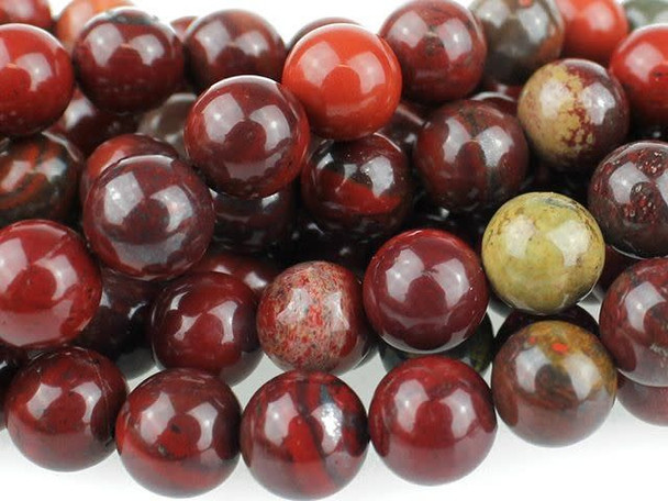 A rich display of color fills the Dakota Stones 8mm Apple Jasper round beads. These beads are perfectly round in shape, so they will work in any classic style. They are the perfect size for matching necklace and bracelet sets. These beads will look great anywhere. These beads feature the rich and juicy colors of fresh apples hanging from a tree. Deep red mingles with hints of leafy green and bark brown. Pair them with earthy colors for a pleasing display. Jasper is an opaque variety of quartz, with a microscopic crystalline structure. Metaphysical Properties: Jasper is thought to improve vision and protect from unseen dangers at night.Because gemstones are natural materials, appearances may vary from piece to piece. Each strand includes approximately 24 beads.