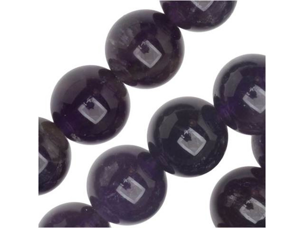 Keep your looks classic and colorful with the Dakota Stones amethyst 8mm round beads. Available by the strand, these beads feature an orb-like shape and dark purple color with the occasional fleck of cloudy white. These beads are the perfect size for use in necklaces and bracelets. Amethyst is the official birthstone of February. It forms in silica-rich liquids deposited in geodes and is generally found in clusters of crystal points. Metaphysical Properties: This stone's name is derived from the Greek word amethystos, meaning "not drunken." People of ancient times believed it to protect the wearer from drunkenness. Today, this gemstone is believed to promote happiness.Because gemstones are natural materials, appearances may vary from piece to piece. Each strand includes approximately 24 beads. Our amethyst beads have nice, deep color, but may show natural inclusions.