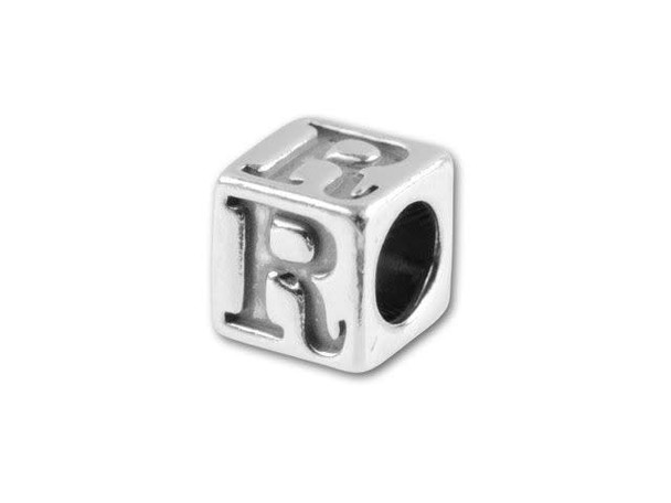 This quality sterling silver alphabet bead features the letter R engraved into four sides. Made in the USA, this 4.5mm alphabet bead features a wonderful cube shape that will stand out in your designs. You can use the wide stringing hole with thicker stringing materials, too. 