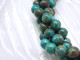 Bring gemstone style to your designs with this Dakota Stones blue sky jasper 10mm round bead strand. These beads feature a classic round shape and a vibrant blue color mixed with greens and browns. Their 10mm size will make them stand out in your projects. Because gemstones are natural materials, appearances may vary from piece to piece.