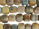Add contemporary flair to designs with the Dakota Stones 7mm Venus Jasper cube beads. These beads feature a modern cube shape. Use them in contemporary designs for a splash of color. They are versatile in size, so you can use them in necklaces, bracelets and even earrings. These gemstone beads feature warm, earthy tones like beige, peach, brown and gray. They are sure to add soothing style to your designs. Venus Jasper takes its name from the planet Venus, which was named for the Roman goddess of love and beauty. It is also referred to as orbicular rhyolite. Metaphysical Properties: Jasper is a stone used from grounding, stability, strength and healing.Because gemstones are natural materials, appearances may vary from piece to piece. Each strand includes approximately 28 beads.